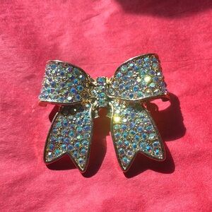 Sparkling Gold Tone Bow Brooch With AB Coated Rhinestones